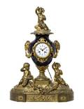 A Napoleon III Sevres Style Gilt Bronze Mounted Porcelain Mantel Clock