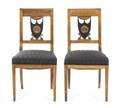 A Pair of Biedermeier Parcel Ebonized Side Chairs