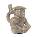 A PreColumbian Terra Cotta Figural Stirrup Vessel