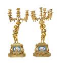 A Pair of Napoleon III Sevres Style Porcelain Mounted Gilt Bronze SixLight Candelabra
