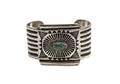 A Navajo Stamped Silver and Turquoise Bracelet Austin Wilson
