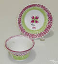 Red and green rainbow spatter cup and saucer 19th c