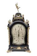 A Continental Black Lacquered Wood and Gilt Ormolu Mounted Mantel Clock