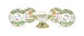 A Collection of Four French Porcelain Dinner Plates and a Footed Bowl