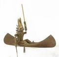 New England carved and polychromed Indian in a canoe whirligig ca 1930