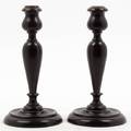 A Pair of Turned Mahogany Candlesticks