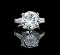 A Platinum and Round Brilliant Cut Diamond Ring