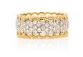 An 18 Karat Gold and Diamond Band Buccellati