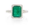 A 14 Karat White Gold Emerald and Diamond Ring