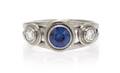 An 18 Karat White Gold Sapphire and Diamond Ring