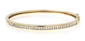 An 18 Karat Yellow Gold and Diamond Hinged Bangle Bracelet