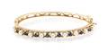 A 14 Karat Yellow Gold Cultured Pearl and Sapphire Hinged Bangle Bracelet