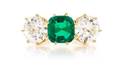 An 18 Karat Gold Emerald and Diamond Ring
