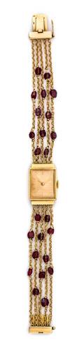 An 18 Karat Yellow Gold and Garnet Multi Strand Wristwatch French