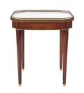 A Louis XVI Style Gilt Metal Mounted Mahogany Occasional Table