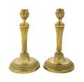 A Pair of Empire Style Brass Candlesticks