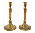 A Pair of Empire Style Brass Candlesticks