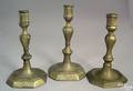Three similar Queen Anne brass candlesticks mid 18th c