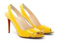 A Pair of Christian Louboutin Yellow Patent Leather Slingback High Heel Shoes