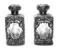 A Pair of English Silver Mounted Glass Bottles