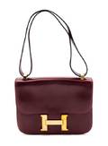 An Hermes 23cm Rouge Leather Constance Bag