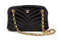 A Chanel Black Chevron Quilted Patent Leather Bag
