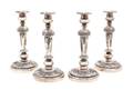 A Set of Four Rococo Style Silver Plate Candlesticks