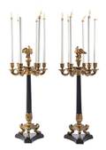 A Pair of Empire Style Gilt and Patinated Metal SixLight Candelabra
