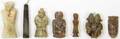 A Group of Seven Carved Archaistic Jade and Hardstone Toggles