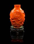 A Carved Red Coral Snuff Bottle
