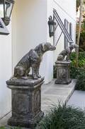 A Pair of Cast Stone Models of Dogs