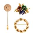 A Collection of Yellow Gold Brooches