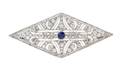 An Art Deco Platinum Diamond and Synthetic Sapphire Brooch