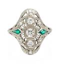 An 18 Karat White Gold Diamond and Synthetic Emerald Ring