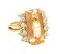 An 18 Karat Yellow Gold Topaz and Diamond Ring