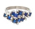 An 18 Karat White Gold Sapphire and Diamond Ring