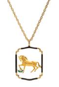 A Yellow Gold Onyx Diamond and Emerald Horse Motif Pendant