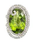 An 18 Karat White Gold Peridot and Diamond Ring