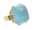 An 18 Karat Yellow Gold Aquamarine and Diamond Ring