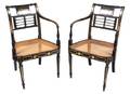 A Set of Four Regency Ebonized and Gilt Decorated Open Armchairs