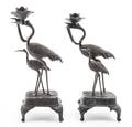 A Pair of Japanese Cast Metal Candlesticks