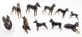 A Collection of Porcelain and Ceramic Models of Doberman Pinschers