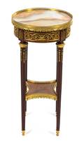 A Louis XVI Style Gilt Bronze Mounted Mahogany and Fruitwood Table