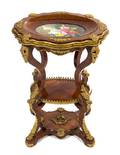A Napoleon III Gilt Bronze and Porcelain Mounted Fruitwood Table