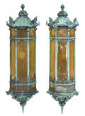 A Pair of Patinated Cast Metal Lanterns