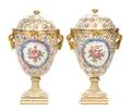 A Pair of Continental Porcelain Urns and Covers