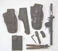 Misc accessories to include leather cased 22 caliber clips