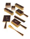 An English 9 Karat Gold Mounted NinePiece Dresser Set
