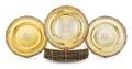 A Set of Twelve American SilverGilt Service Plates