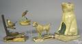 Four polychrome decorated squeak toys 19th c